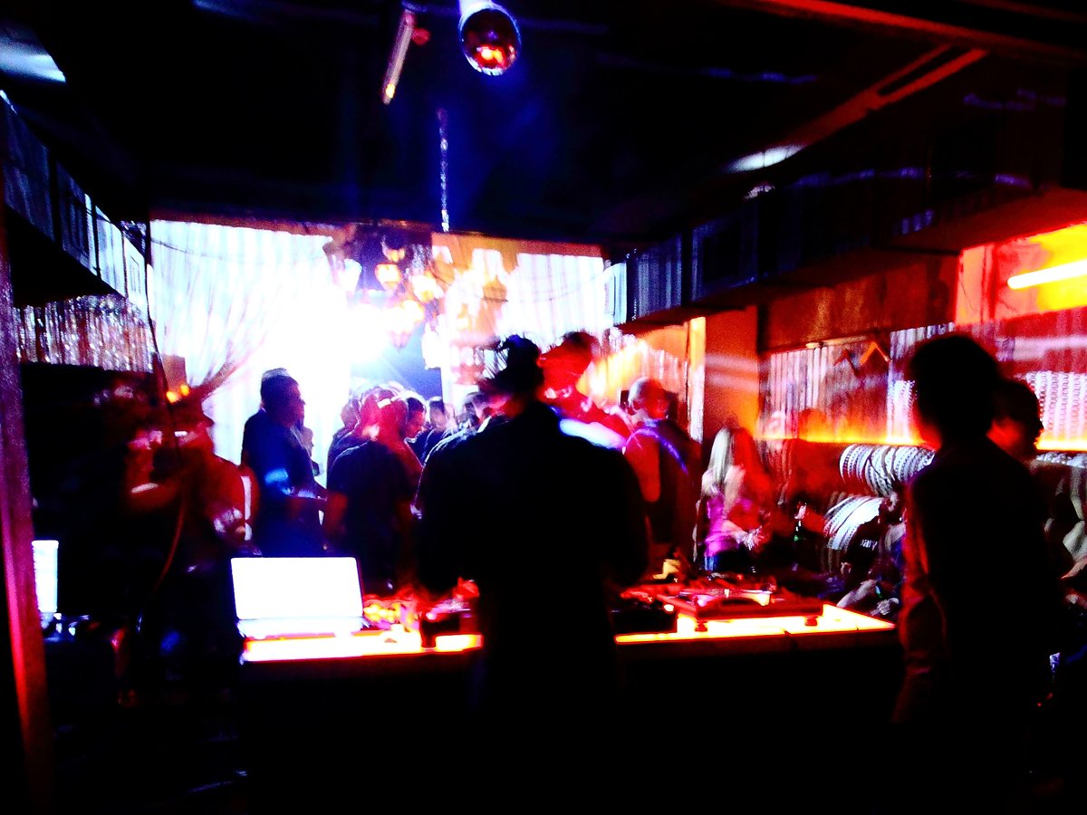 Dance to house music at an underground nightclub in Berlin, like Tresor.