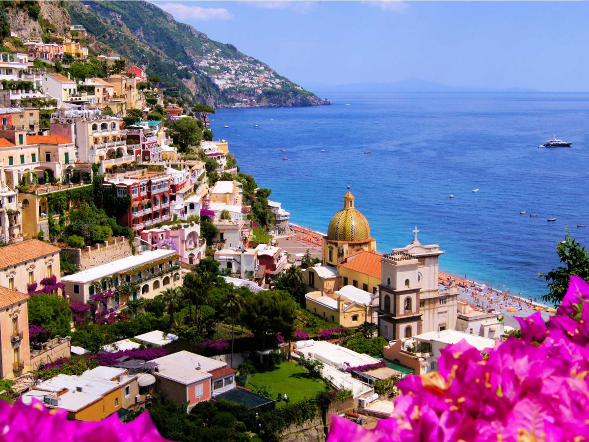 Hug the cliffs while driving along the Amalfi Coast in Italy, and visit the charming towns of Positano, Ravello, and Salerno.