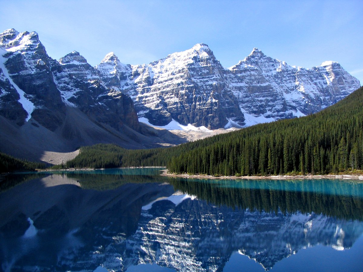 See the reflection of the spectacular Rocky Mountains in Moraine Lake at Banff National Park, Canada.