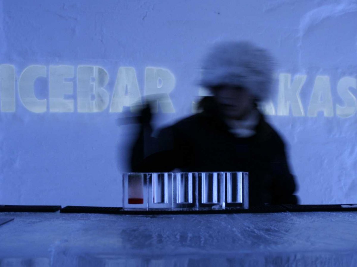 Sip on a cocktail in a glass made entirely of ice at the ICEBAR, a bar inside Sweden's ICEHOTEL Jukkasjärvi.