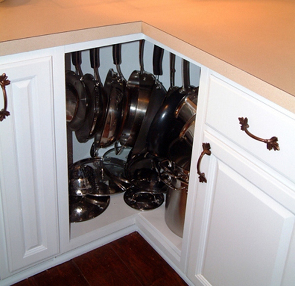Fill awkward corner cabinets with pots and pans, using hooks or lazy susans