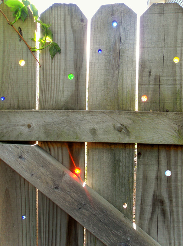 Glass Marbles Into Fence Decor