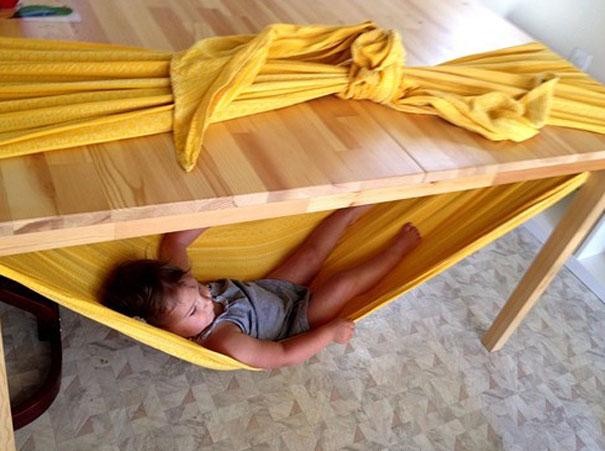 (My personal favorite) Create a kid-sized hammock with some fabric and a table.
