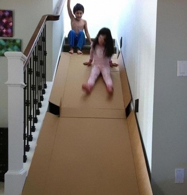 If you're super careful, a big cardboard box can be re-purposed into a stair slide.