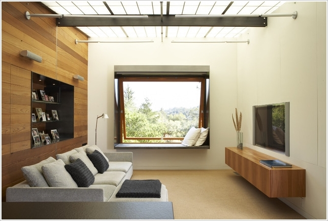 A Room With A Skylight Ceiling And A Window Seat