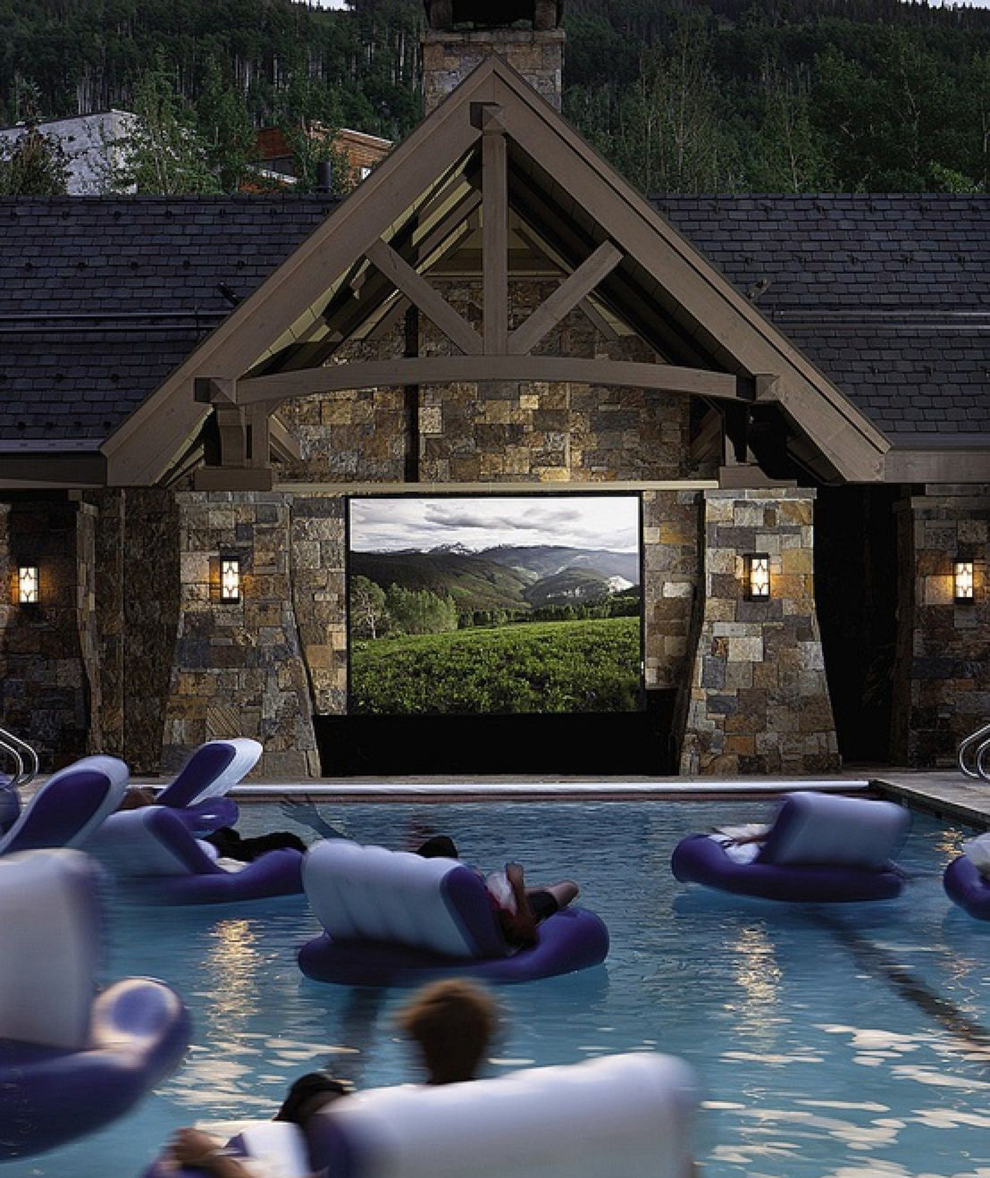 Floating in a swimming pool movie theater