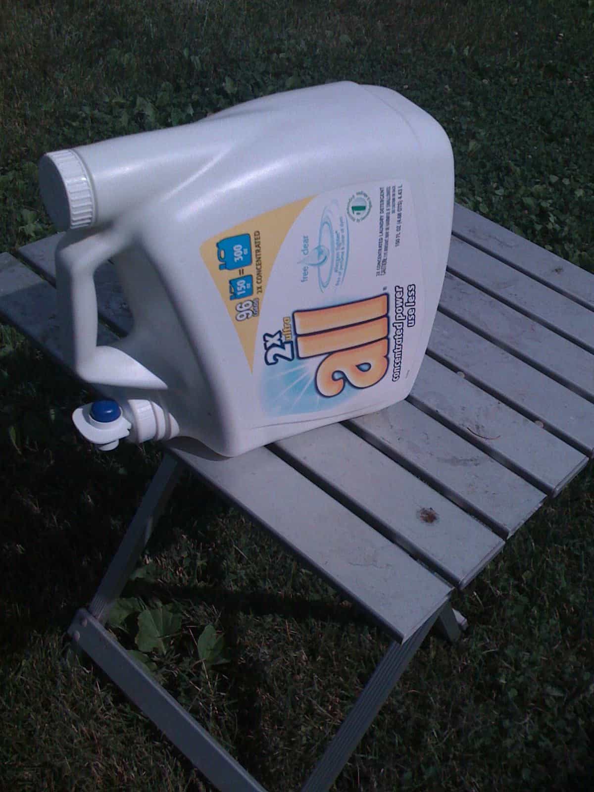 Use an empty laundry detergent dispenser as a hand-washing station.