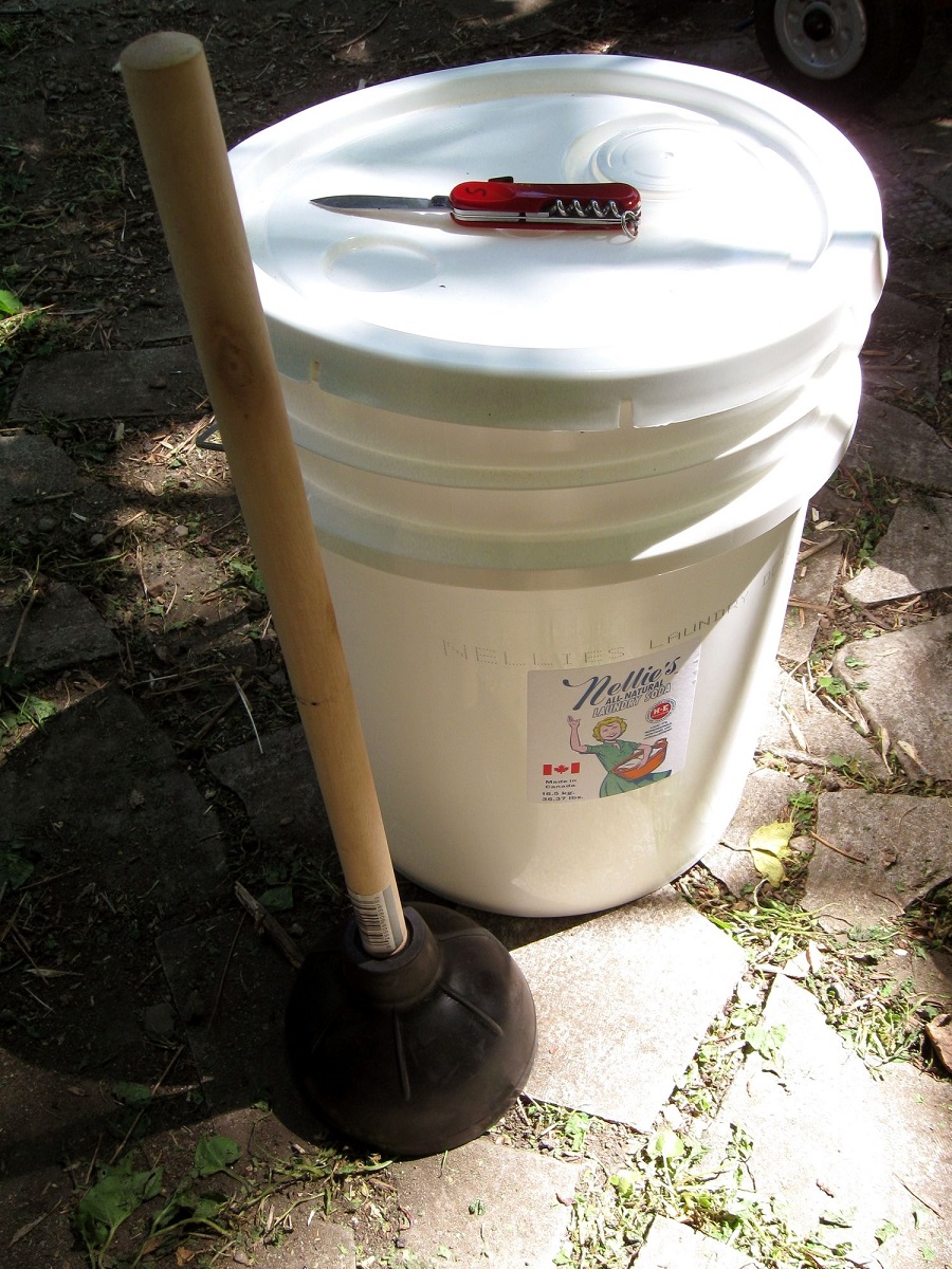 Make a portable washing machine with a plunger and a bucket.