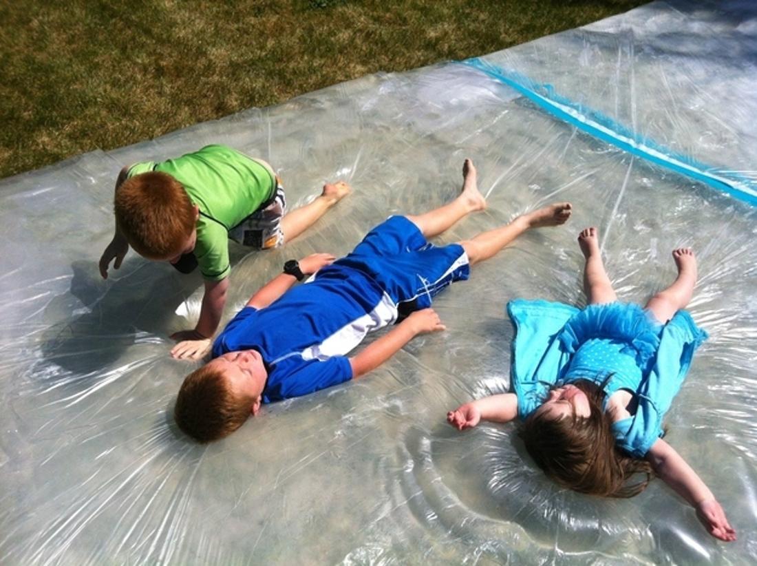 Make a giant outdoor water bed for the kids.