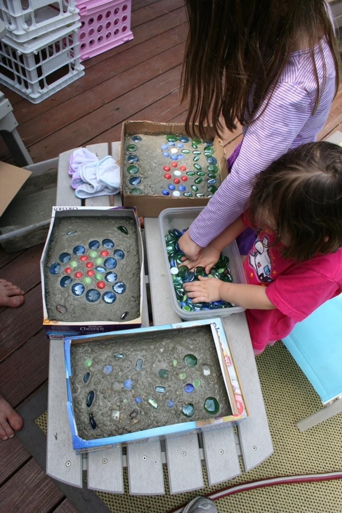 Enlist the kids to help you make stepping stones out of cement, cereal boxes, and glass stones.