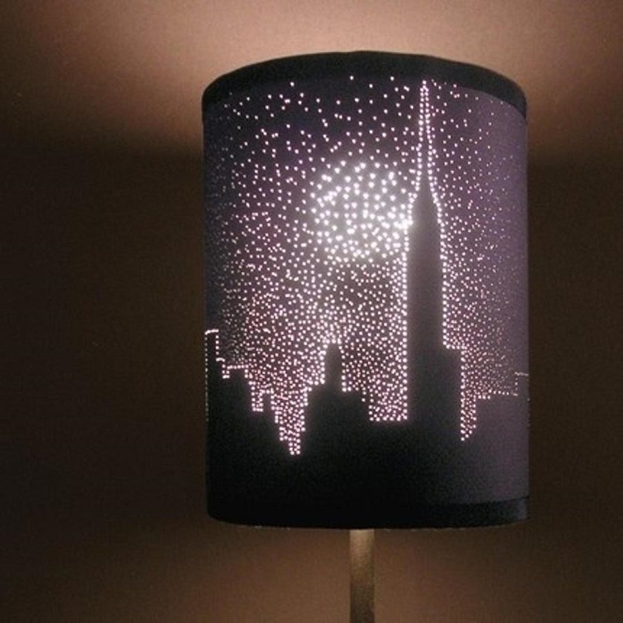 Poke holes in a dark lampshade for a starry effect.