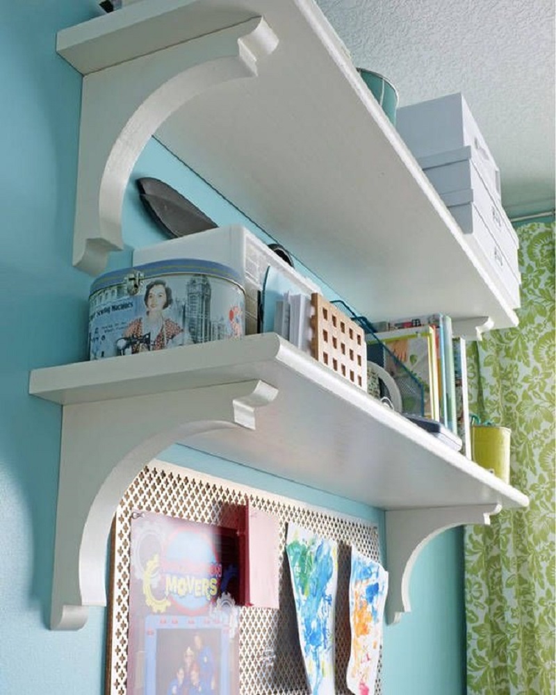 For a cheap and classy alternative to bookshelves, use stair treads and corbels.
