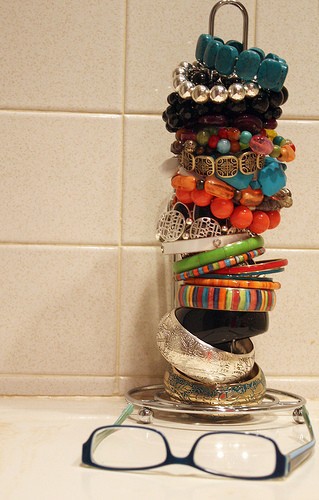 Use Glass Bottles To Store Bracelets And Ponytail Holders
