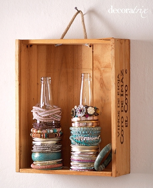 Use Glass Bottles To Store Bracelets And Ponytail Holders