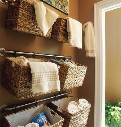 Hang Baskets On Rails To Store Towels And Shower Supplies