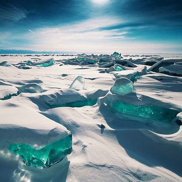 Turquoise Ice Exposed At Lake Baikal In Russia