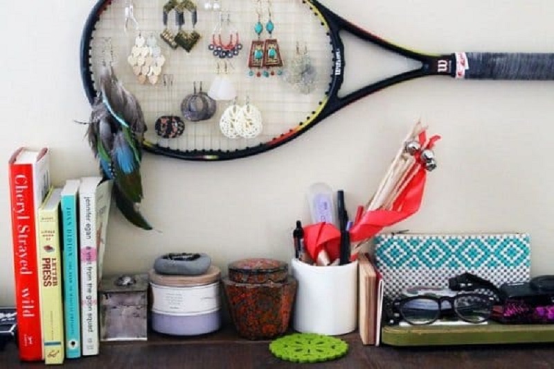 A Tennis Or Badminton Racket Is A Creative Way To Hang Your Jewelry.