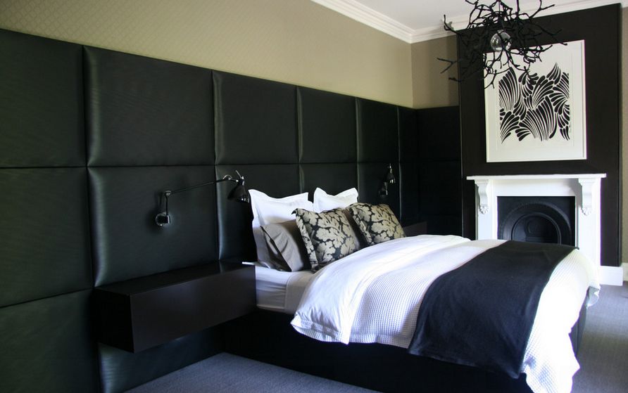 black-leather-headboard-white-bedding-and-chandelier