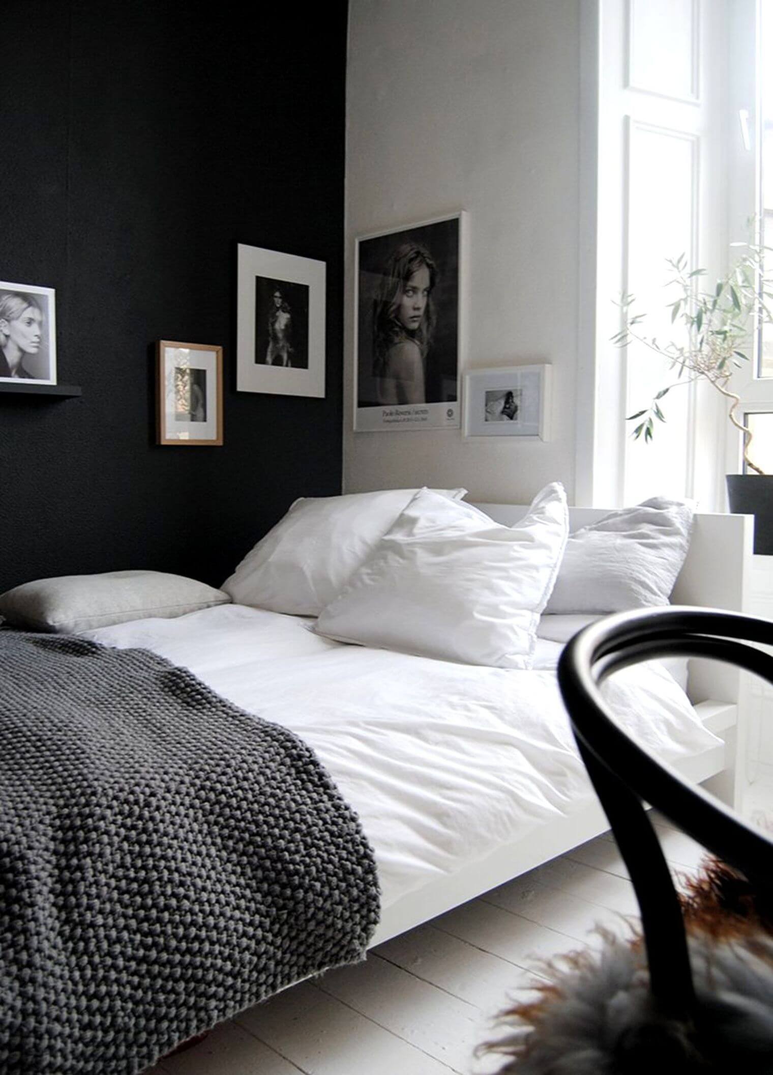 black-wall-bedroom-decorated-with-frames