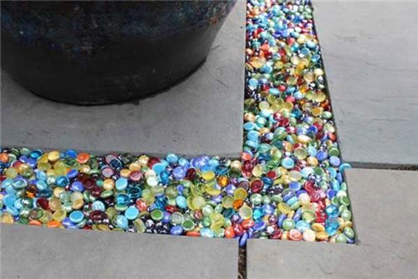 Colored Glass Is Used To Fill The Gap Between Paving Stones: