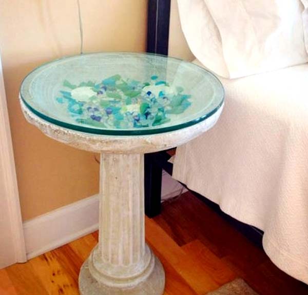 A Bird Bath Table Displays Colorful Sea Glass: