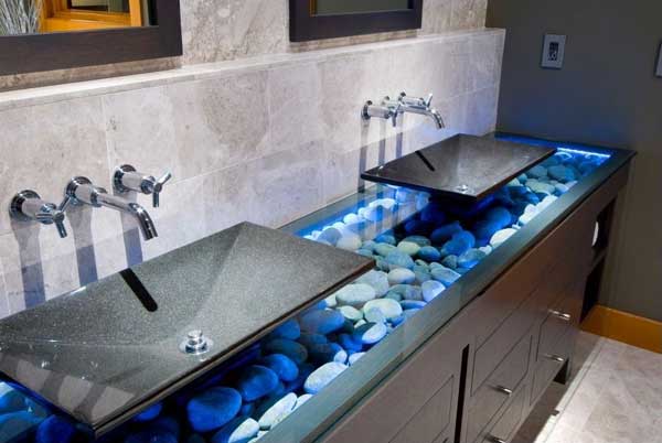 River Rocks Showcased Behind A Glass Top Under The Sink