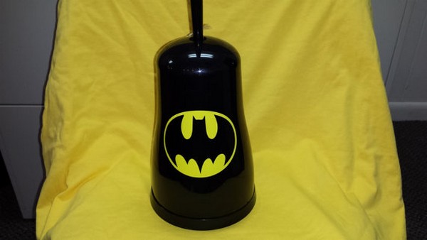 Geeks everywhere will love this Batman toilet brush holder.