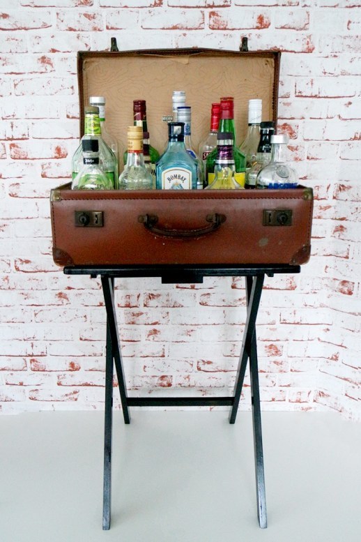 Secure An Old Suitcase To A TV Table For A Small But Stylish Bar.