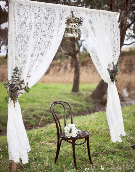 Make A simple Entrance Or Photobooth Backdrop With Lace Curtains.