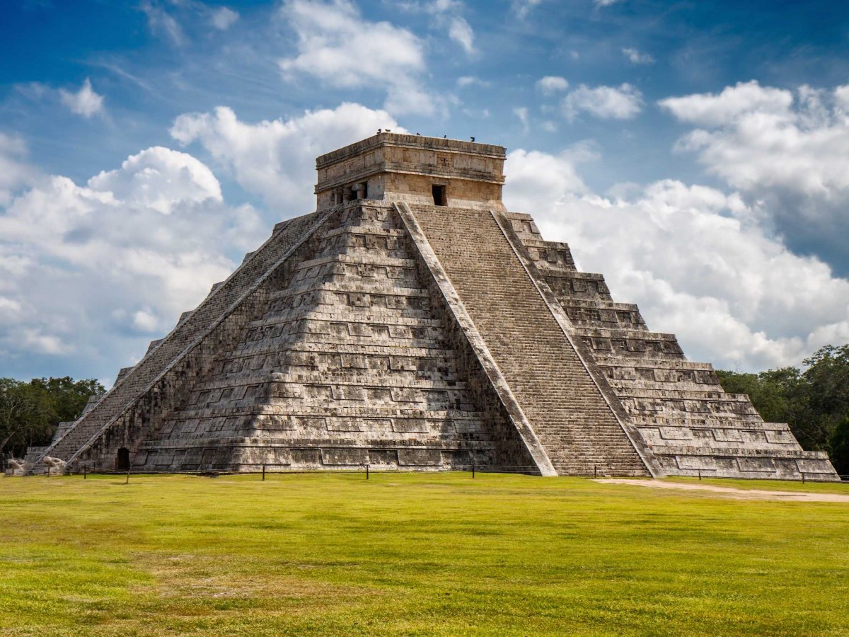 The sacred site of Chichén Itzá in Tinum, Mexico, has a rich 1,000-year history as one of the main Mayan centers of the Yucatán peninsula. The first settlement of the site dates back to 415-455 A.D.