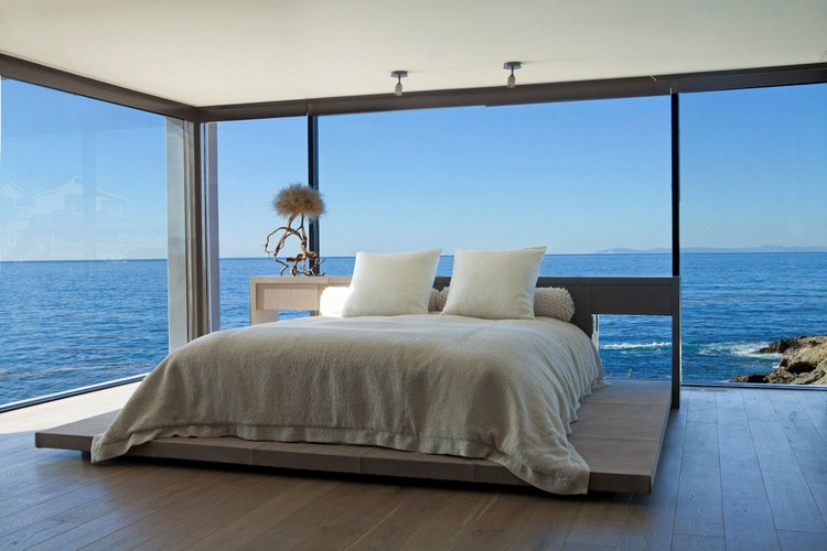 Floor-To-Ceiling Windows Flooding Bedroom With Natural Light