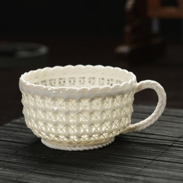 The woven design in this cup turns it into a bit of an optical illusion. While light penetrates the design, it still holds water.