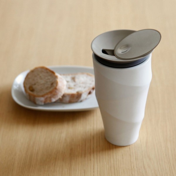 This premium coffee mug is a stylish alternative to a typical commuter mug. It is made from double-walled porcelain and is soft to the touch on the outside.