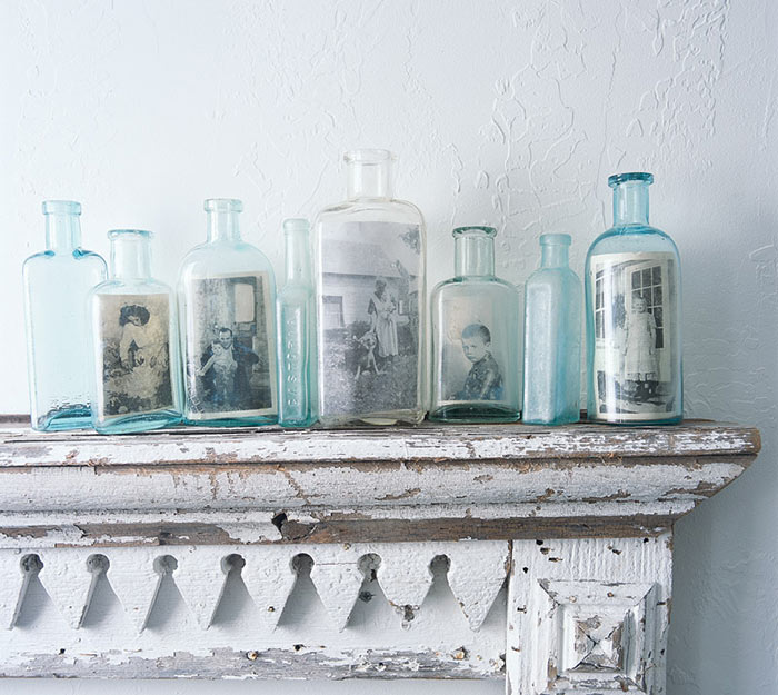 This Is A Clever And Original Way Of Displaying Old Family Photos. The Idea Is Similar To The Classical Ship In A Bottle. Find Some Simple Glass Bottles And Insert The Photos Inside The Bottles. They Would Look Great On The Mantel.