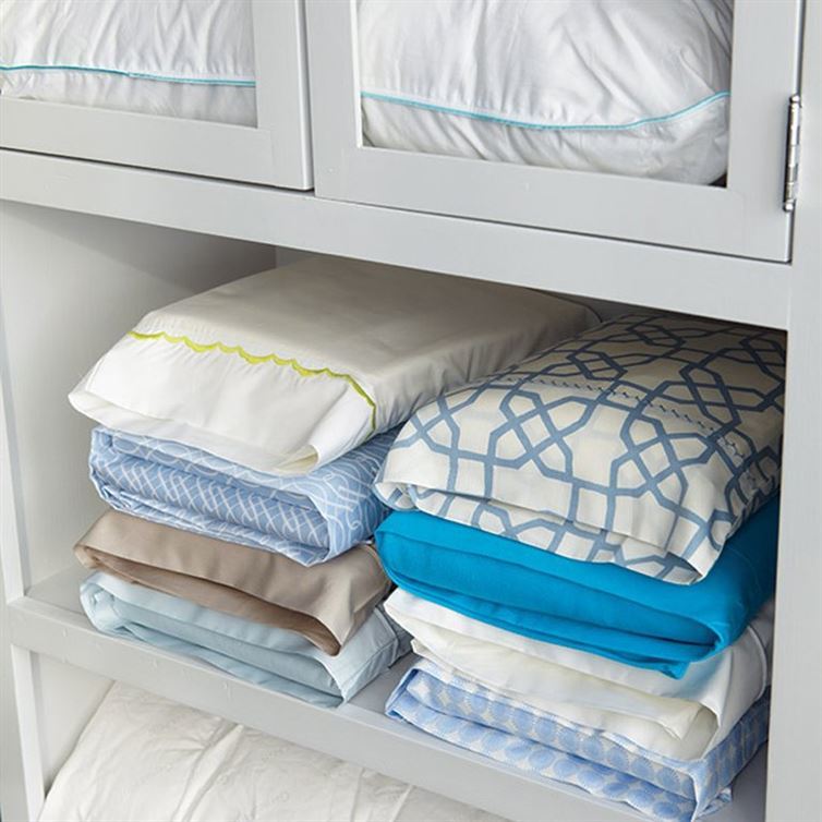 Use pillow cases to keep matching sheets together