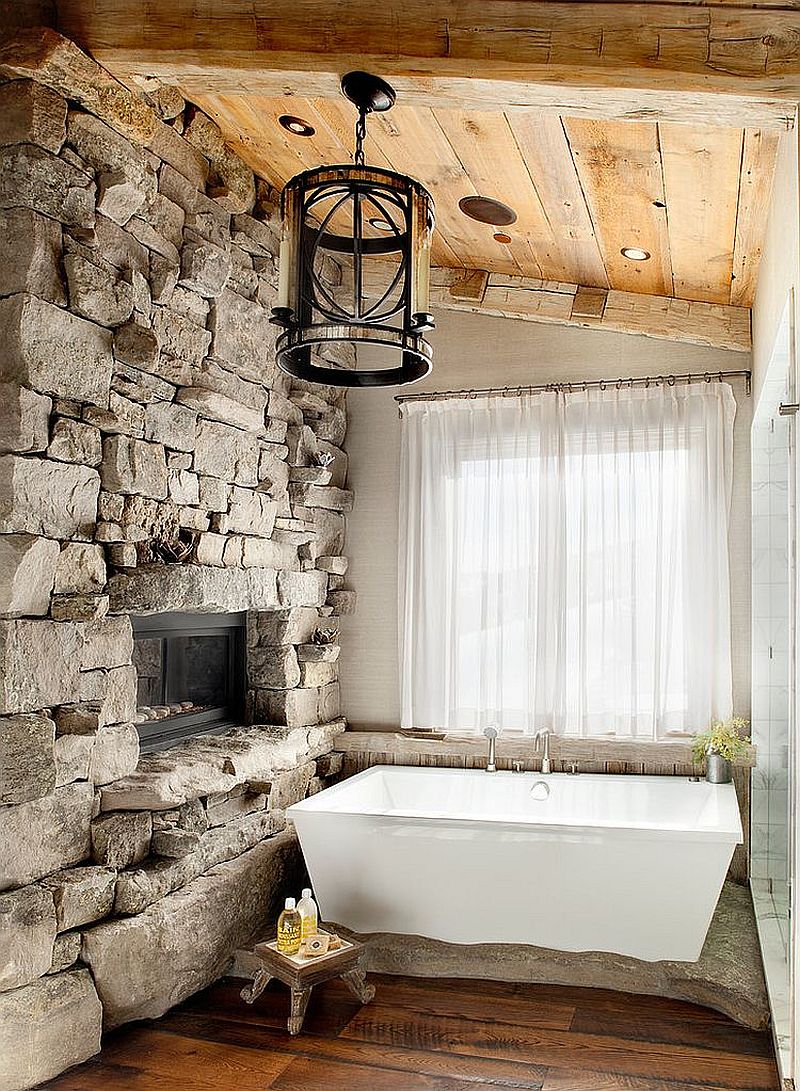 02-AD-Ski-lodge-inspired-rustic-bathroom-with-a-stone-wall-and-sheer-curtains