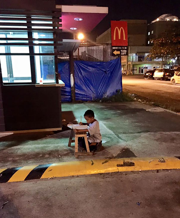 Homeless Boy Does His Homework Using The Light From A Local Mcdonald's
