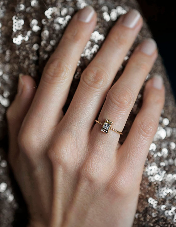 This dainty princess cut diamond ring: