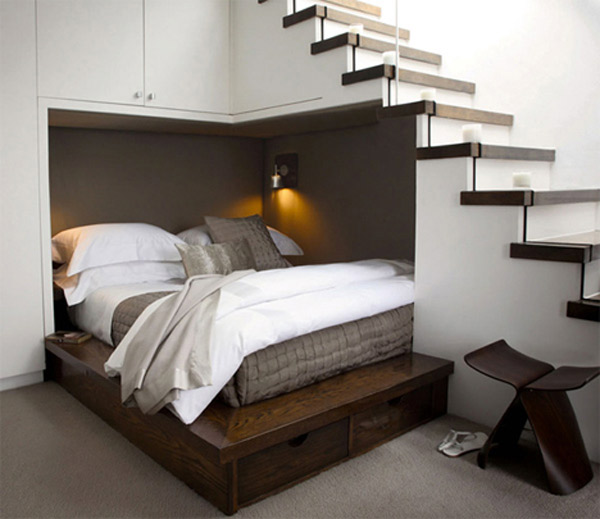 A bed Tucked Under the Stairway