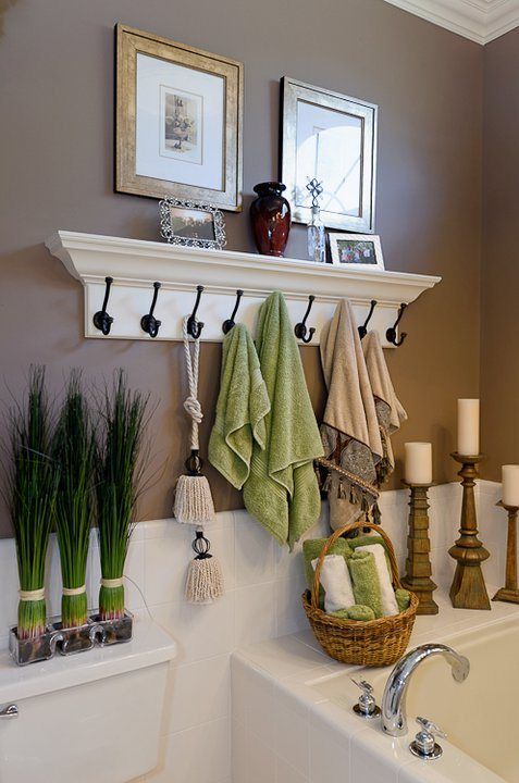 Use Coat Hooks Instead Of A Towel Rod To Hang More Towels