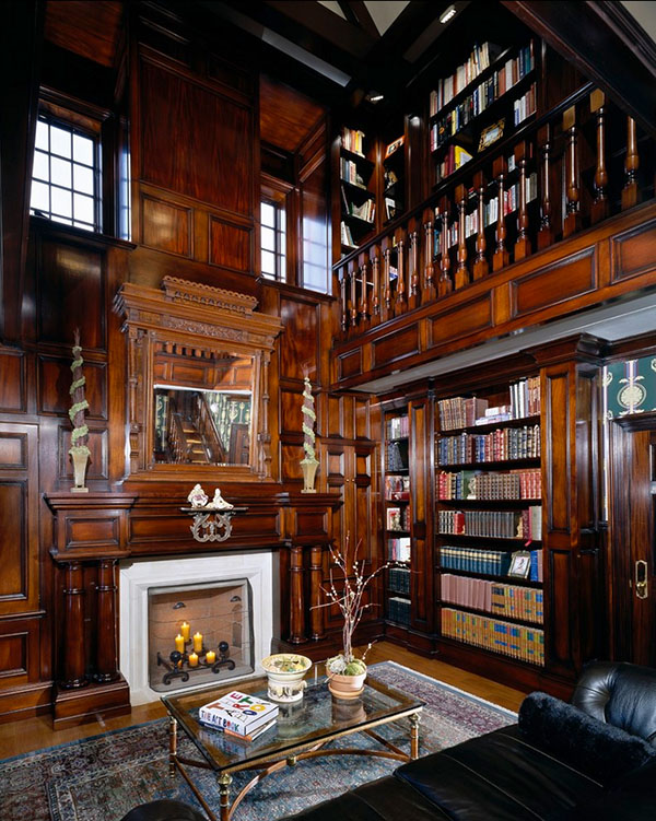 Traditional home library with dark-stained wooden furniture and ornate details
