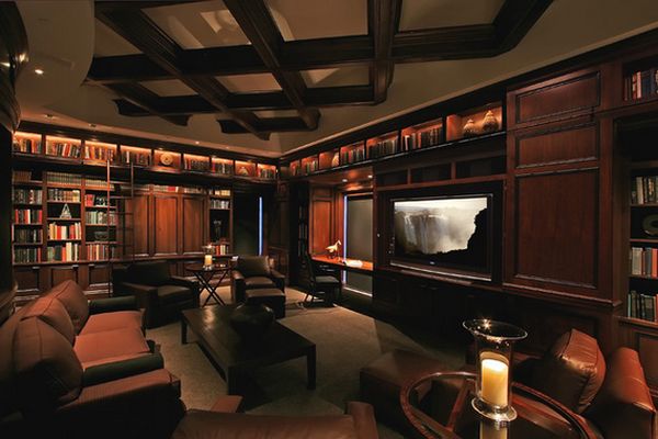 This home library is also a media room and the mood lighting gives it a mysterious feel