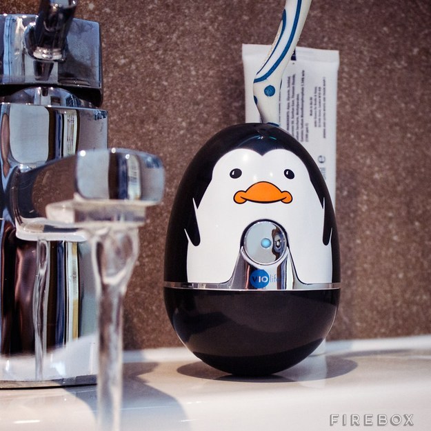 A penguin who will sanitize your toothbrush.
