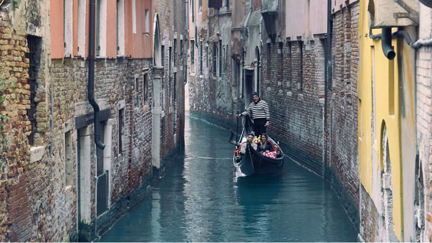 Taking A Peaceful Gondola Ride In Venice, Italy