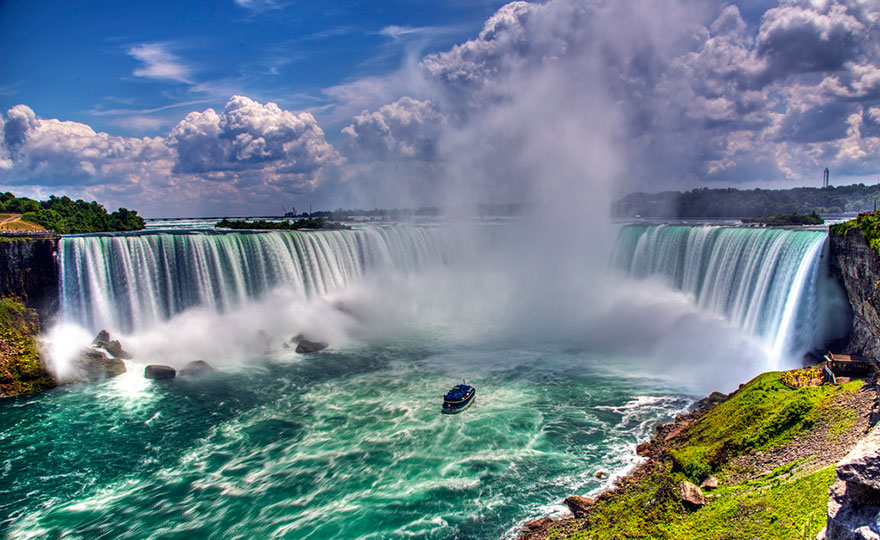 Admiring The Glorious Niagara Falls, Which Marks The Border Between Canada And USA