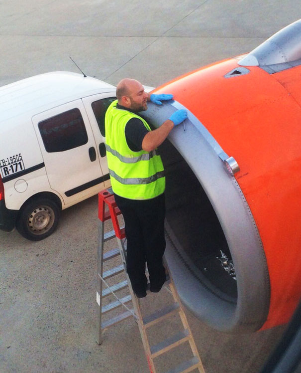 Airplane Passenger Spots Worker Fixing Jet Engine With Tape Before Take-off
