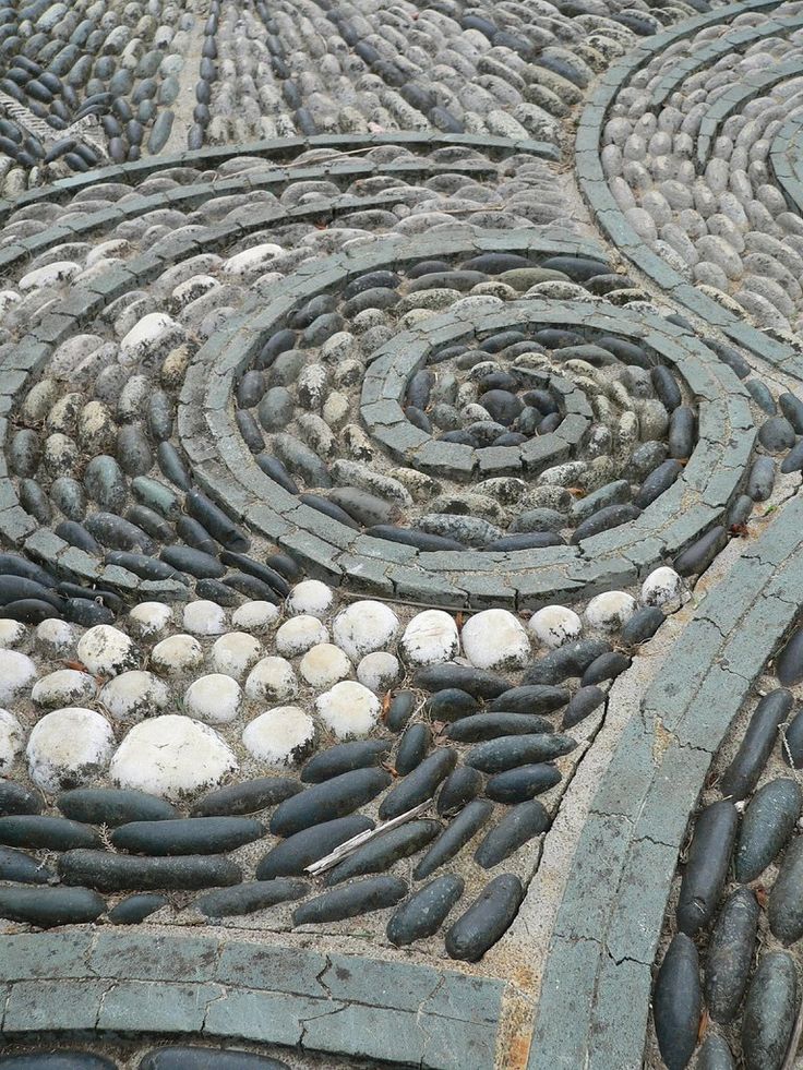 Here In This Photo Is An Up Close Look At The Intricate Detailed Art Of Skillfully Laid Pebbles