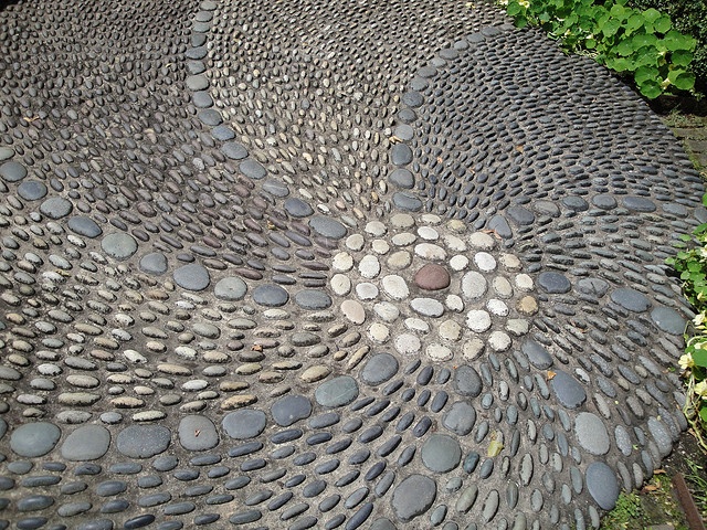 Circular Pattern Made With Pebble Mosaic In This Garden
