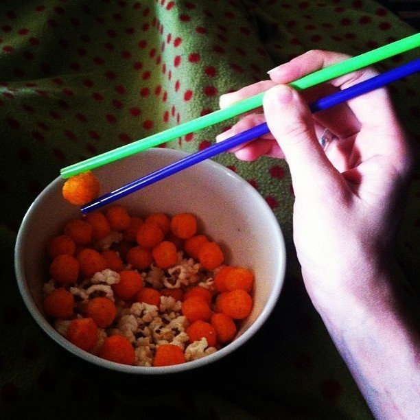 If you don't like the residue cheesy snacks leave on your fingers, try eating them with chopsticks.