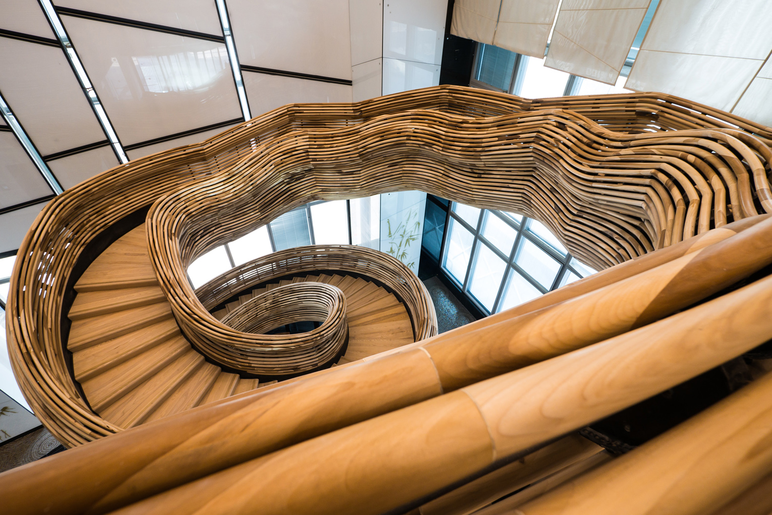4. Photography by Itay Sikolski - The railings are constructed of 9,000 meters of raw Poplar wood, cut in a CNC machine to form a series of arches that were then assembled in-situ